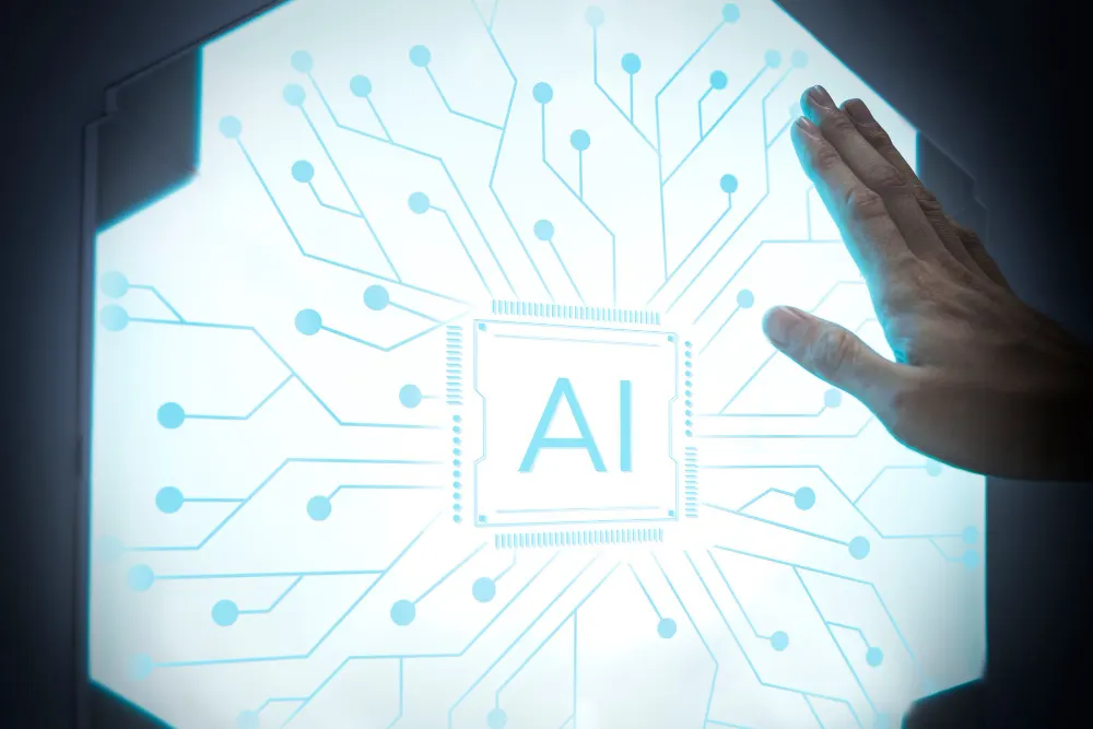 Mão apoiada sobre um painel luminoso hexagonal com um chip central marcado AI e traços de circuito azul.